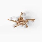 Matya wooden sputnik ceiling light with three frosted glass globe bulbs and natural wood arms against white studio background