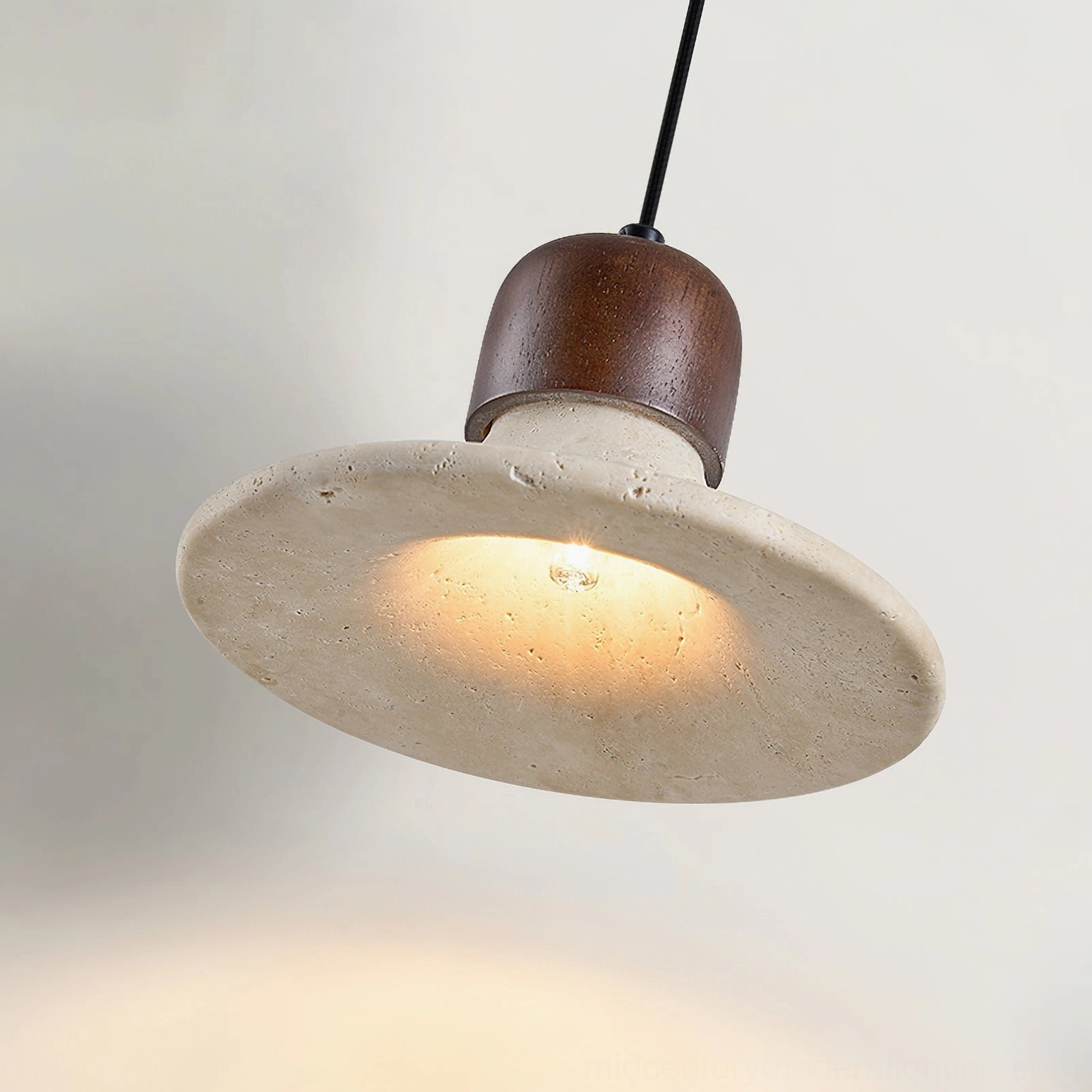 Mayu pendant lamp side profile showing natural porous travertine stone texture detail