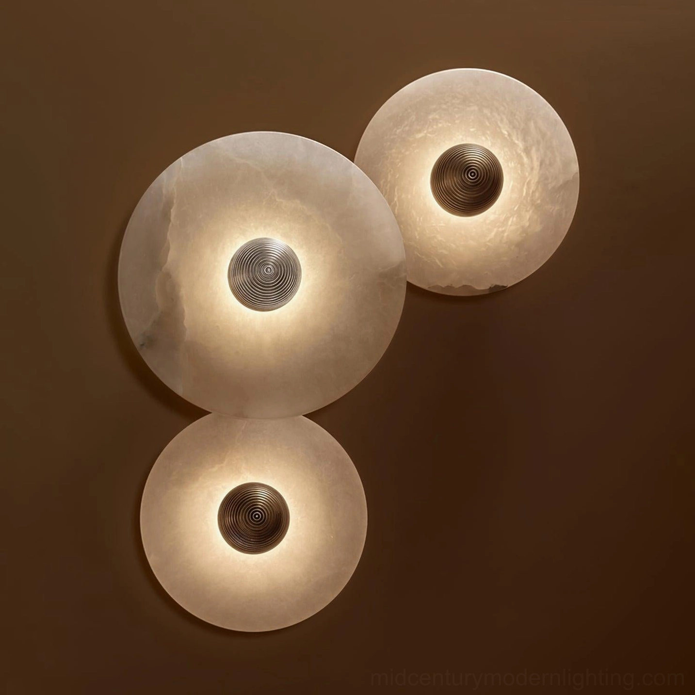 Side view of fluted alabaster wall light, sculptural depth, shadow patterns from internal LED