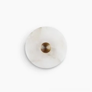 Median alabaster round wall light with fluted stone disc, front view isolated on white background