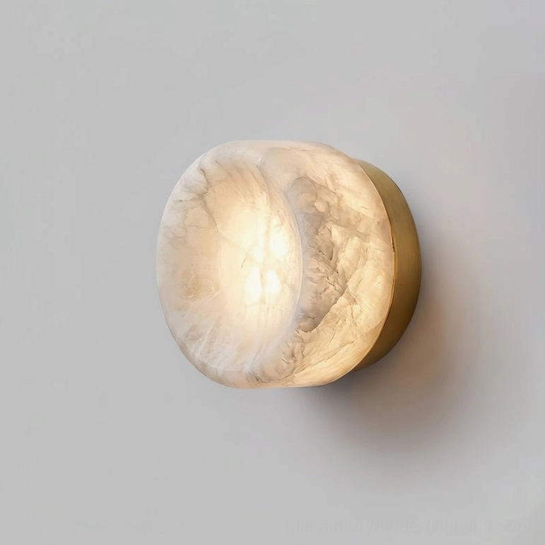 Medium size alabaster sconce with brass finish in modern bedroom corner ambient lighting installation
