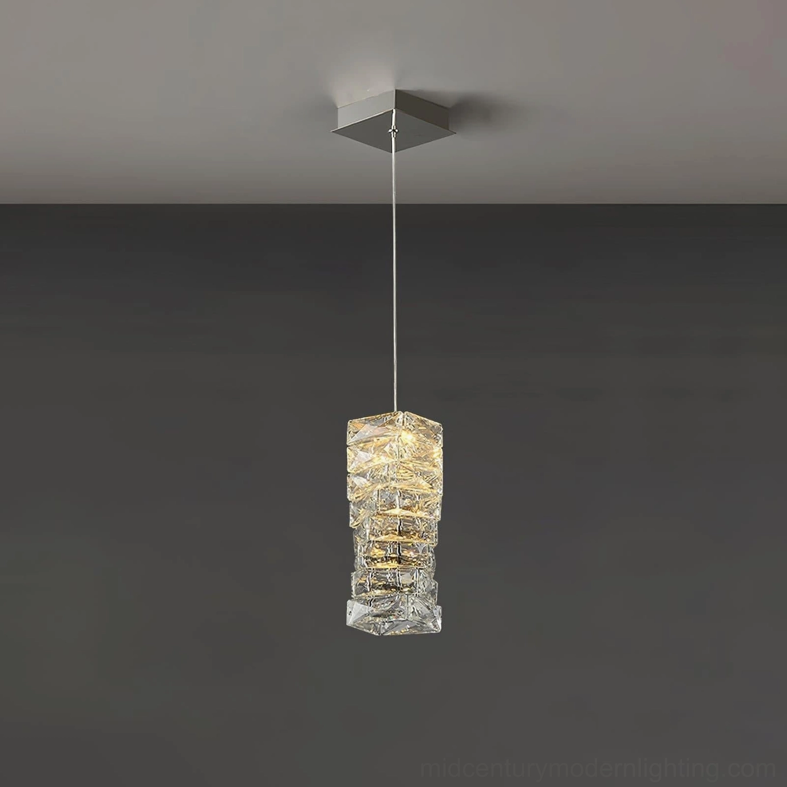 Medium-sized faceted crystal pendant lamp suspended at eye level demonstrating interior lighting application
