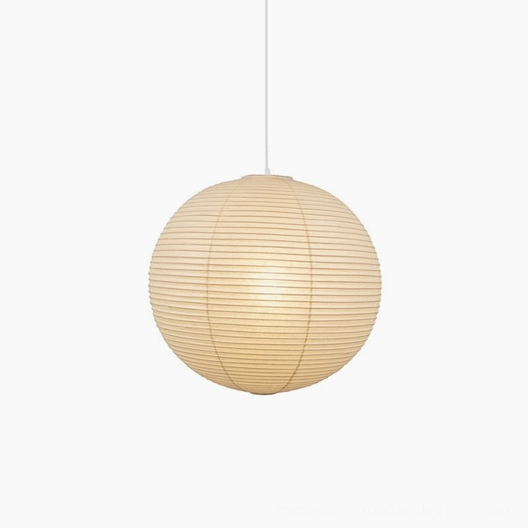 Medium washi paper sphere pendant light in residential dining space with warm ambiance