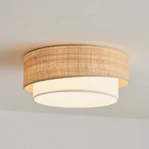 Lit Melanie ceiling light fixture glowing warm ambient light from woven raffia diffuser in bedroom