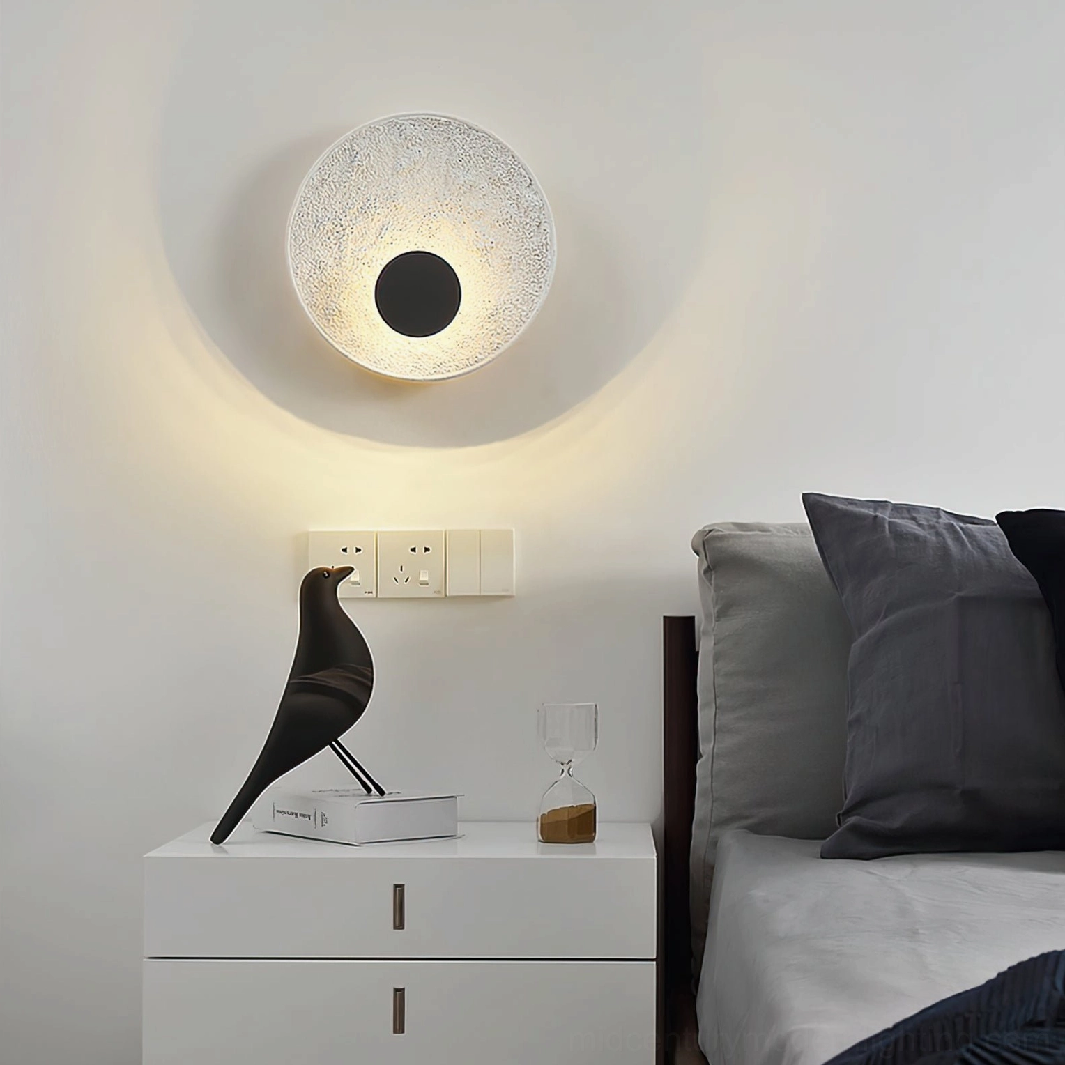 Melesa wall mounted round lamp in bedroom setting beside white nightstand minimalist interior design