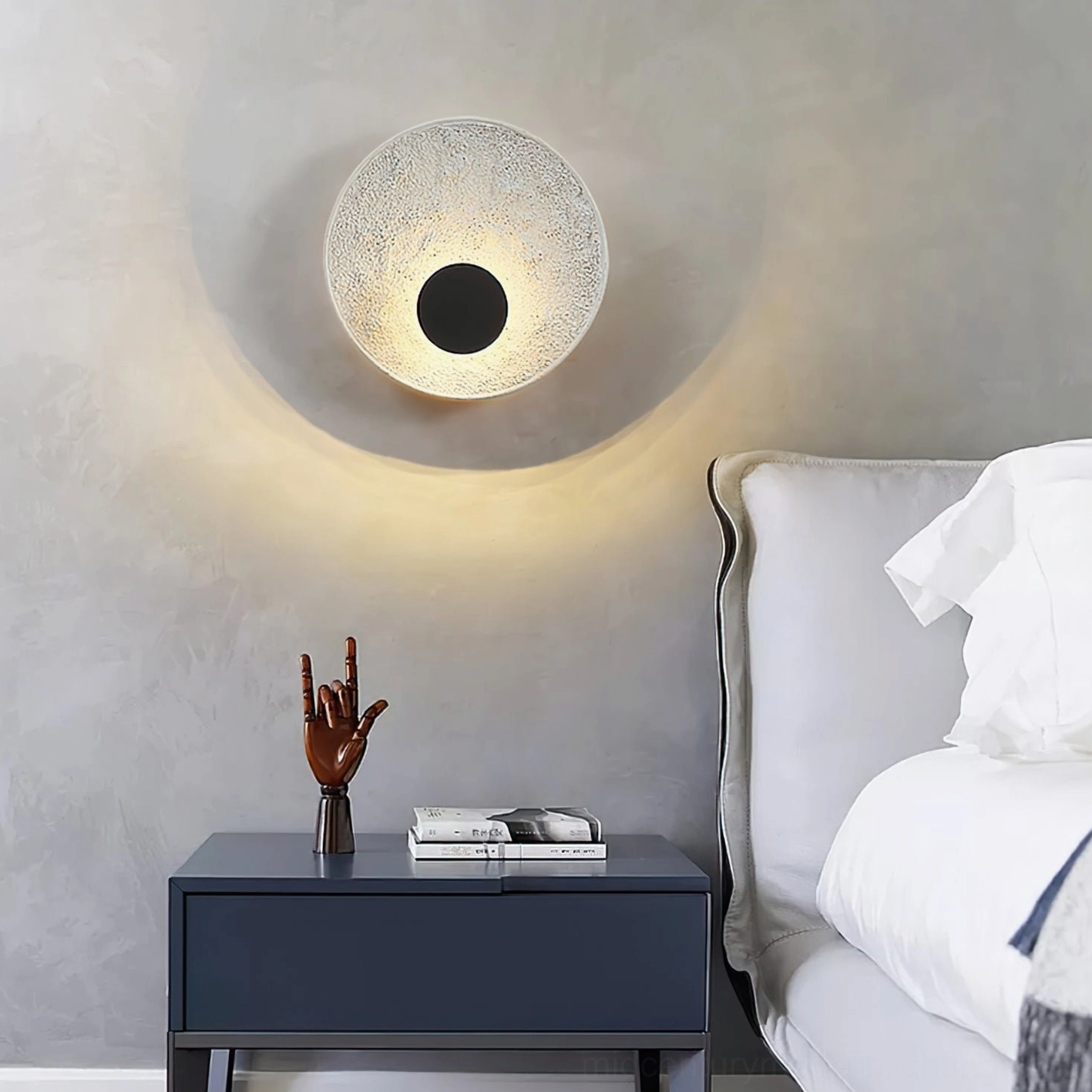 Melesa circular wall light in bedroom with dark blue nightstand contemporary minimalist bedroom design