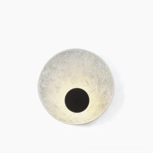 Melesa circular textured resin wall sconce front view studio lighting modern minimal design