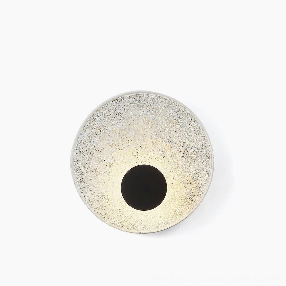 Melesa circular textured resin wall sconce front view studio lighting modern minimal design