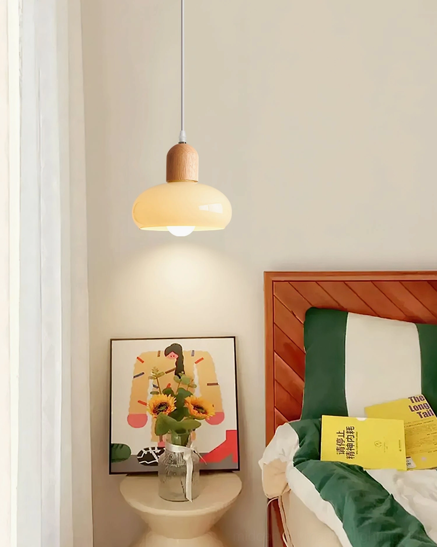Mellow wood-tone glass pendant lamp installed as bedside lighting fixture in contemporary bedroom retreat