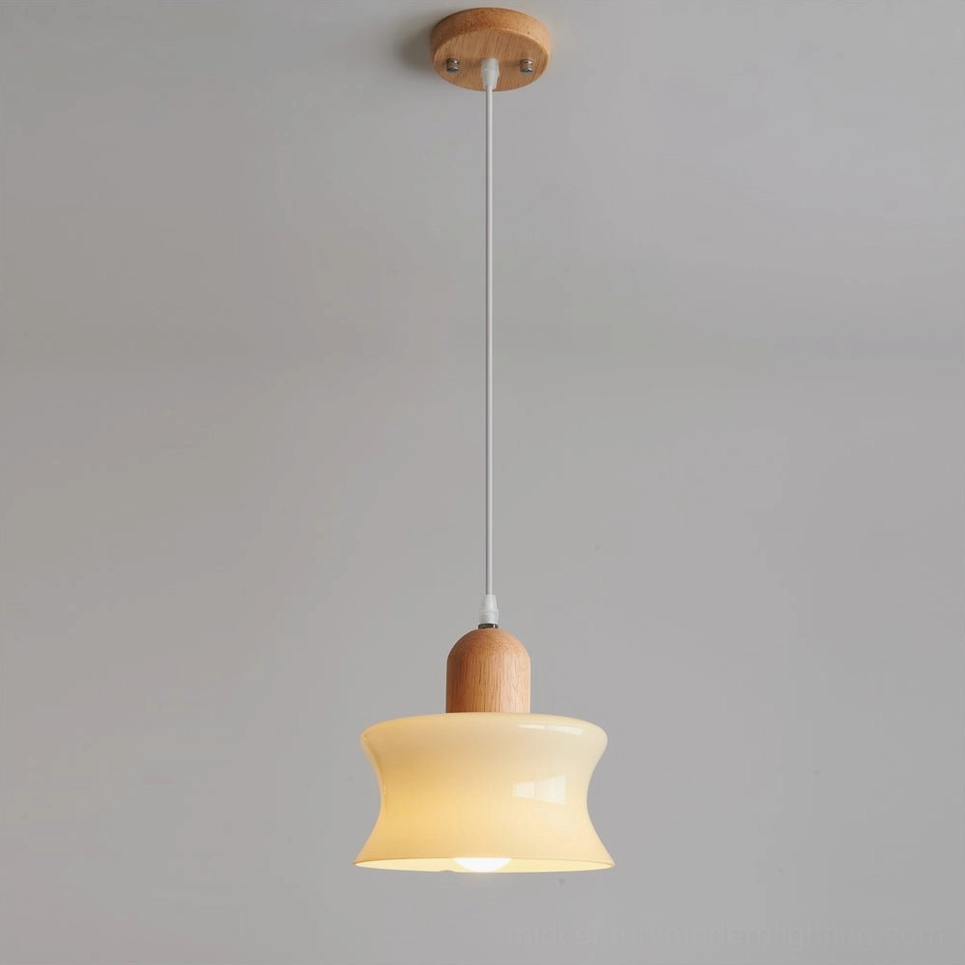 Mellow cream glass pendant light suspended from adjustable wire, studio view showing complete fixture and mounting hardware
