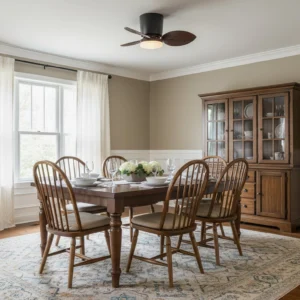 Melorie ceiling fan light installed in traditional farmhouse dining room, eye-level view showing flush mount design and ambient lighting
