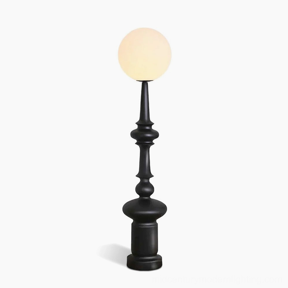 Melrose mid-century modern floor lamp with frosted white globe shade and matte black resin pole on white background studio shot
