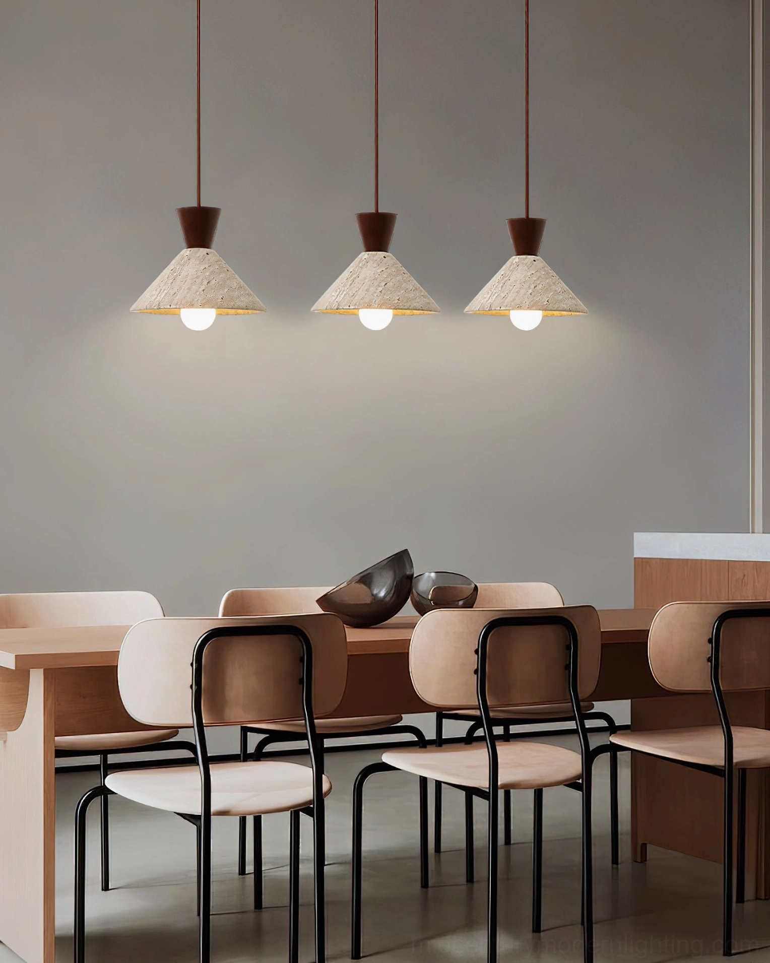 Three Menra travertine pendant lights formal dining room scene upholstered chairs contemporary interior