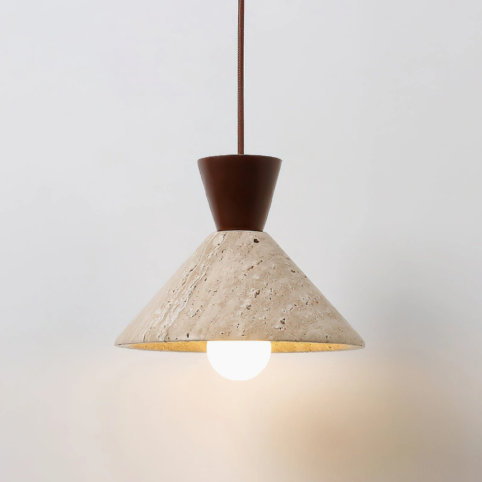 Menra travertine pendant light close-up front view dark wood base exposed bulb detail