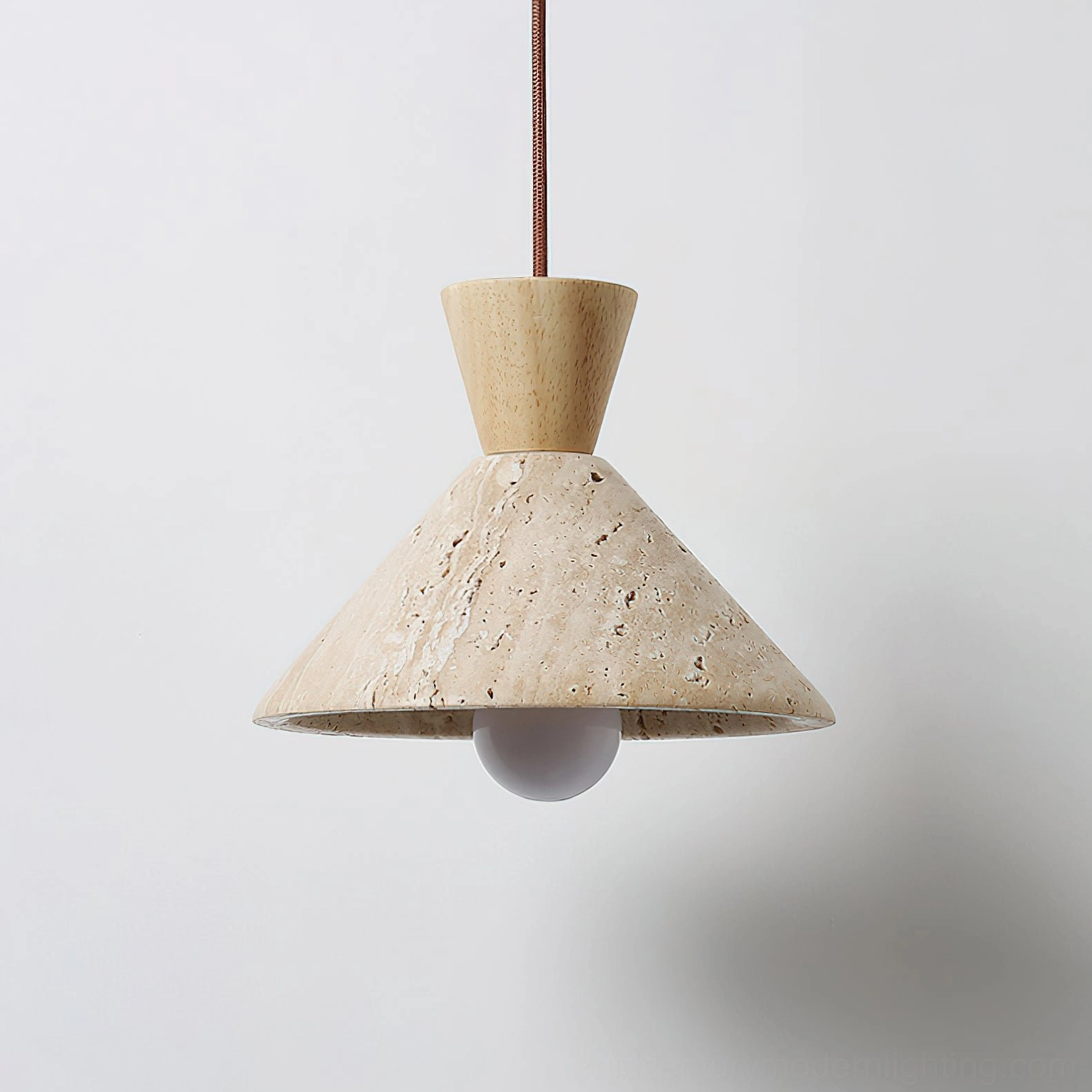 Menra travertine pendant light three-quarter view textured stone shade organic modern design