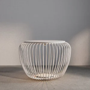 White Meridiano garden side table lamp eye-level view concrete wall backdrop