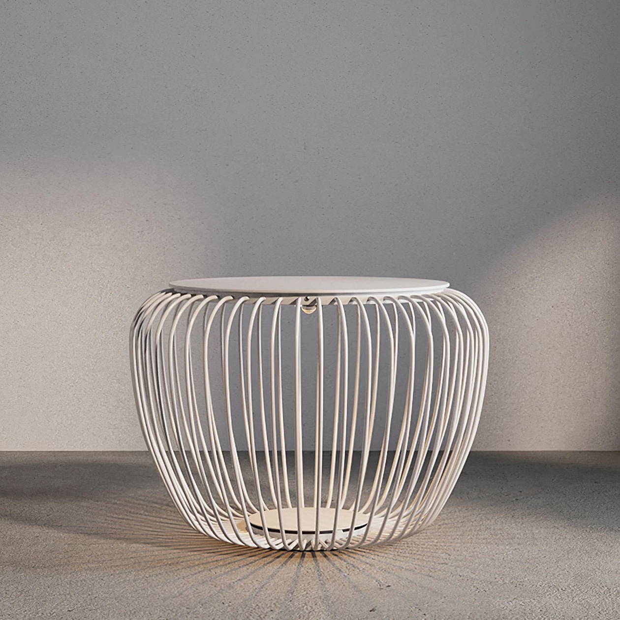 White Meridiano garden side table lamp eye-level view concrete wall backdrop