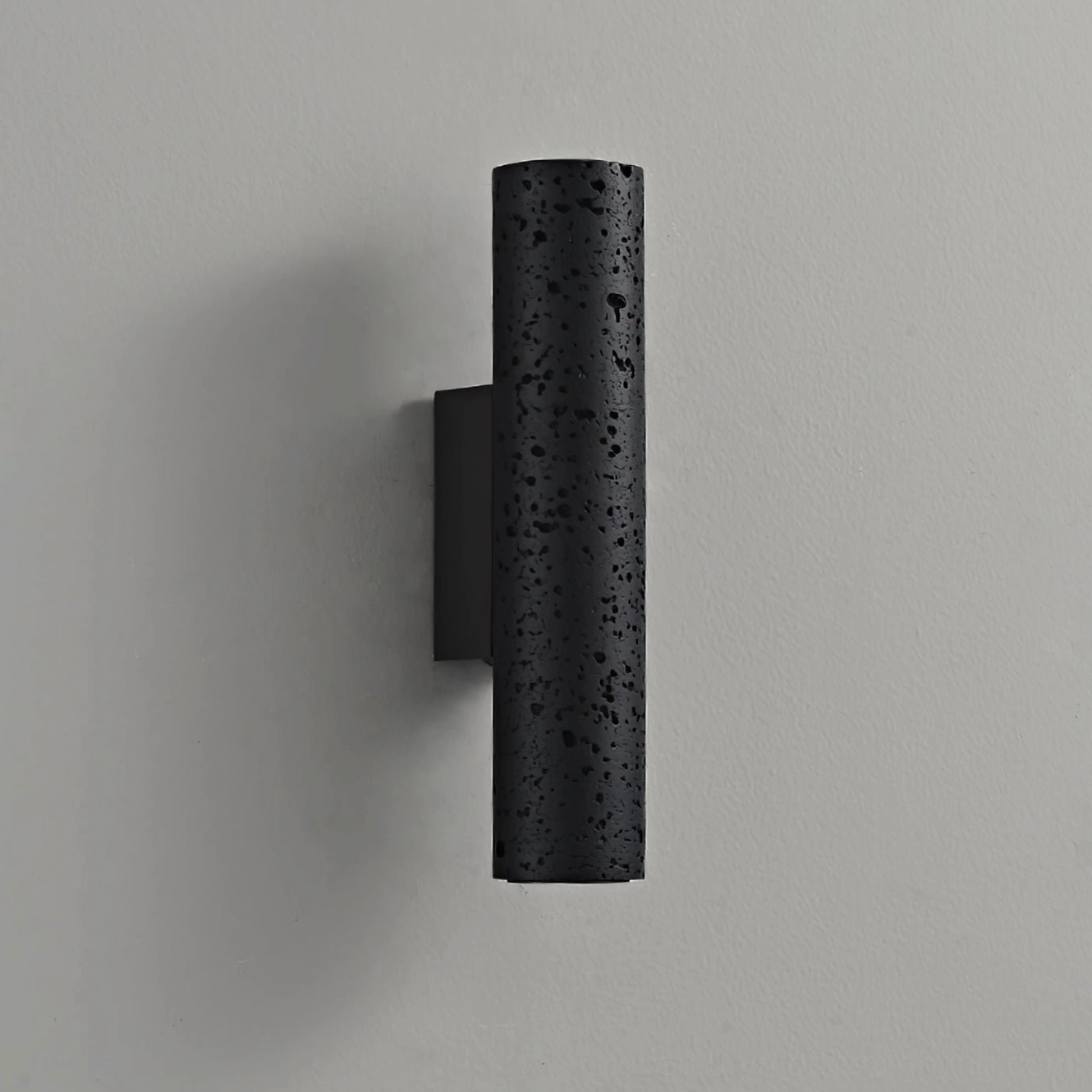 Meta wall lamp alternative angle showing cylindrical form and integrated LED warm light distribution