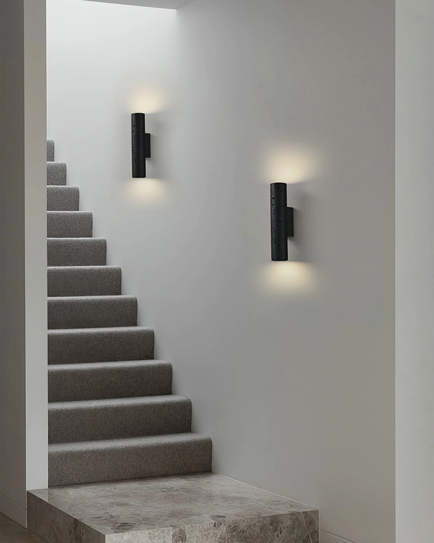 Dual Meta cylindrical wall lamps installed on residential stairwell, paired fixture architectural lighting design