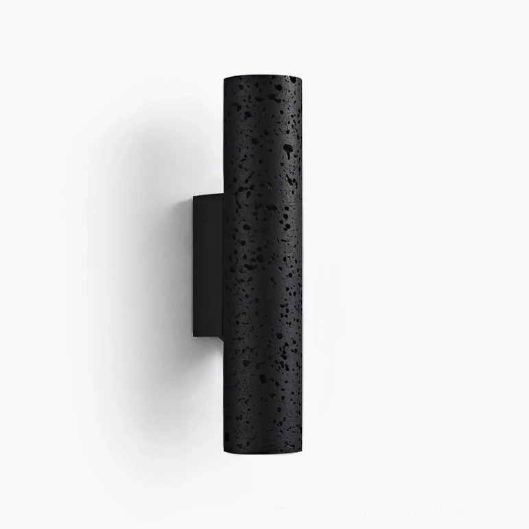 Meta cylindrical wall lamp front flat shot, minimalist black travertine design on white showcase background