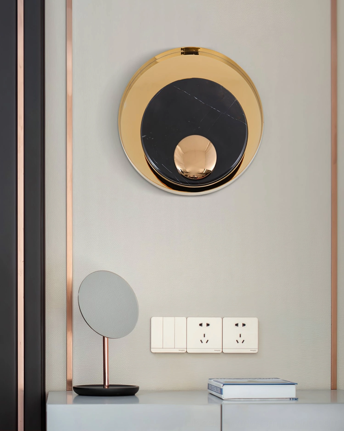 Black marble round wall lamp in minimalist geometric modern luxury console room setting, front view