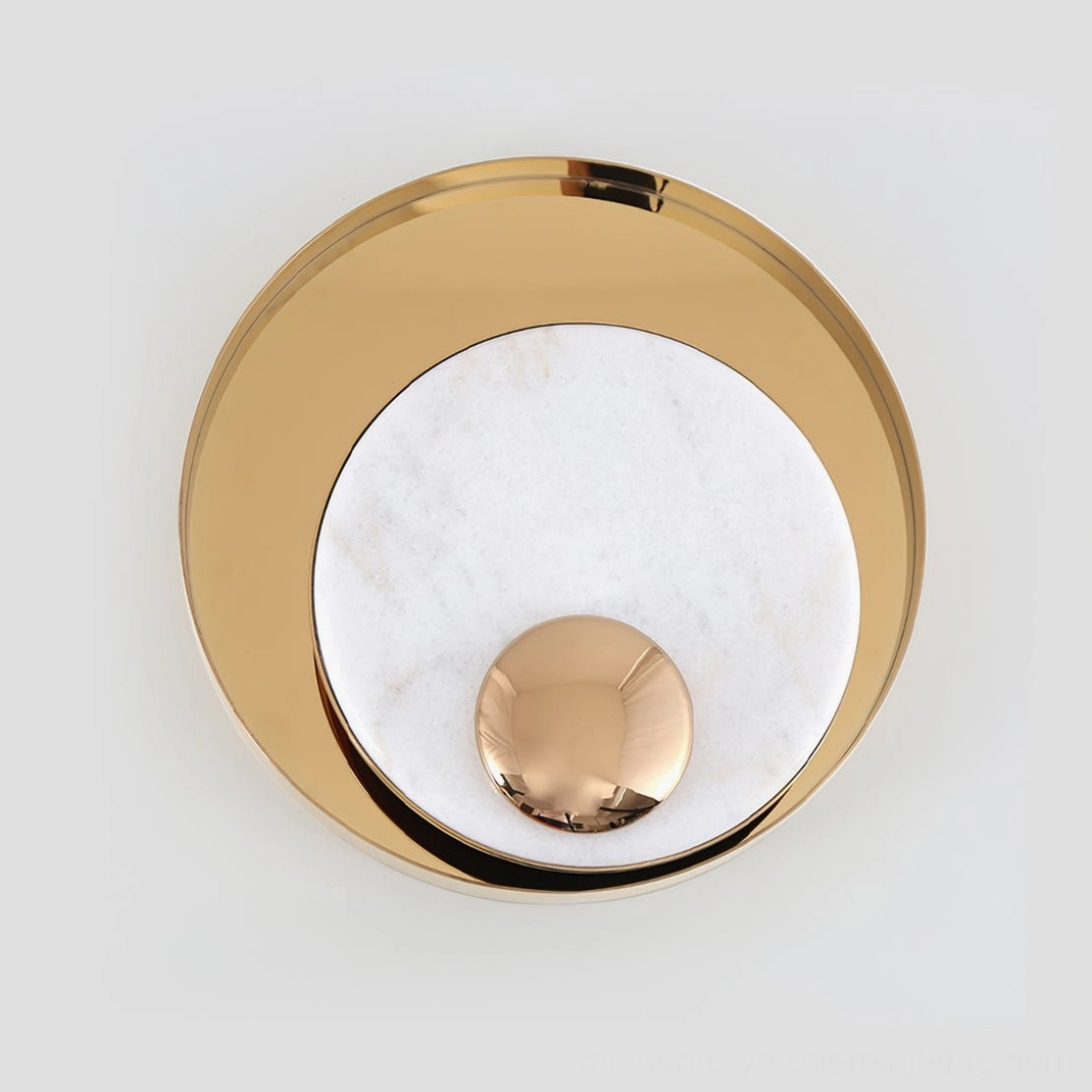 Black and gold Metamorphosis wall lamp in dramatic luxury interior setting, sculptural marble wall light