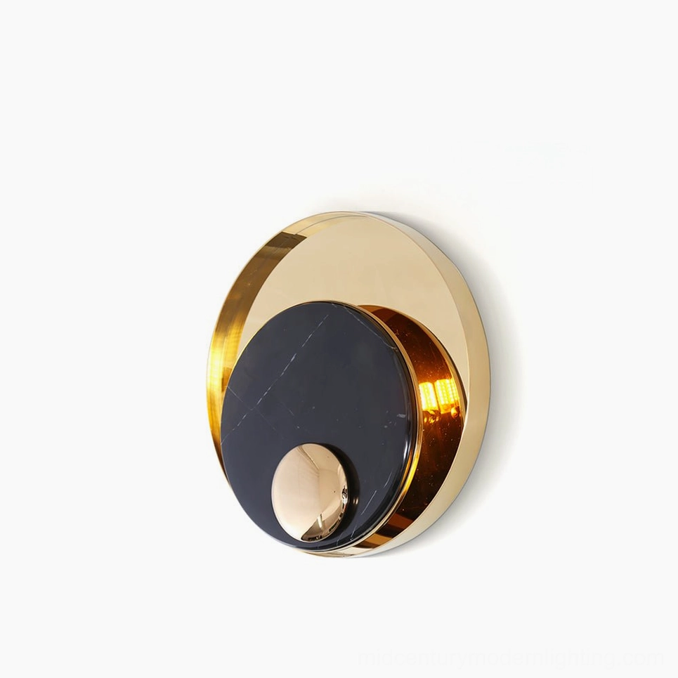 Metamorphosis modern wall lamp with dual-tone black and white marble and gold geometric design, front view on studio white background
