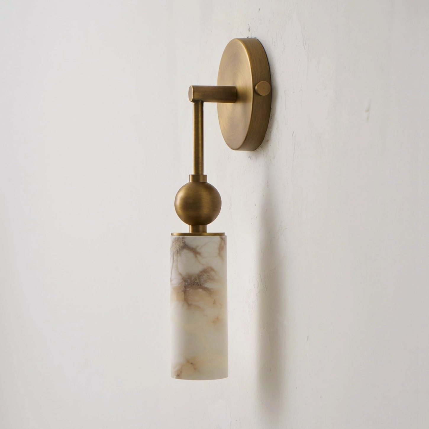 Single-head Metro Alabaster wall sconce in brass and white finish with minimalist modern frame