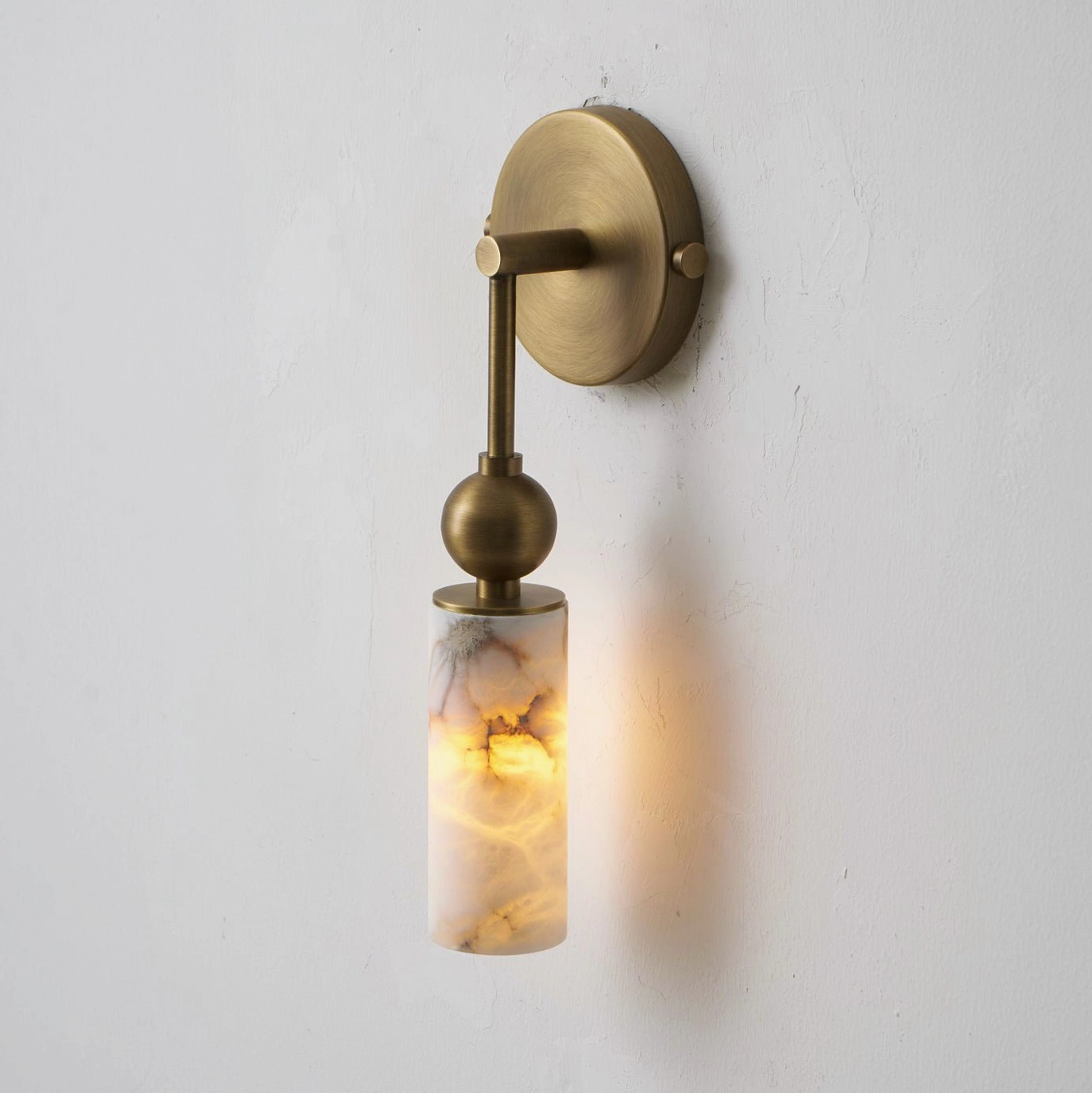 Single-head Metro Alabaster wall sconce in nickel finish with elegant minimalist design