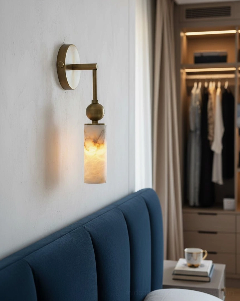 Close-up detail of Metro Alabaster wall lamp showing brass base and natural alabaster cylindrical shade