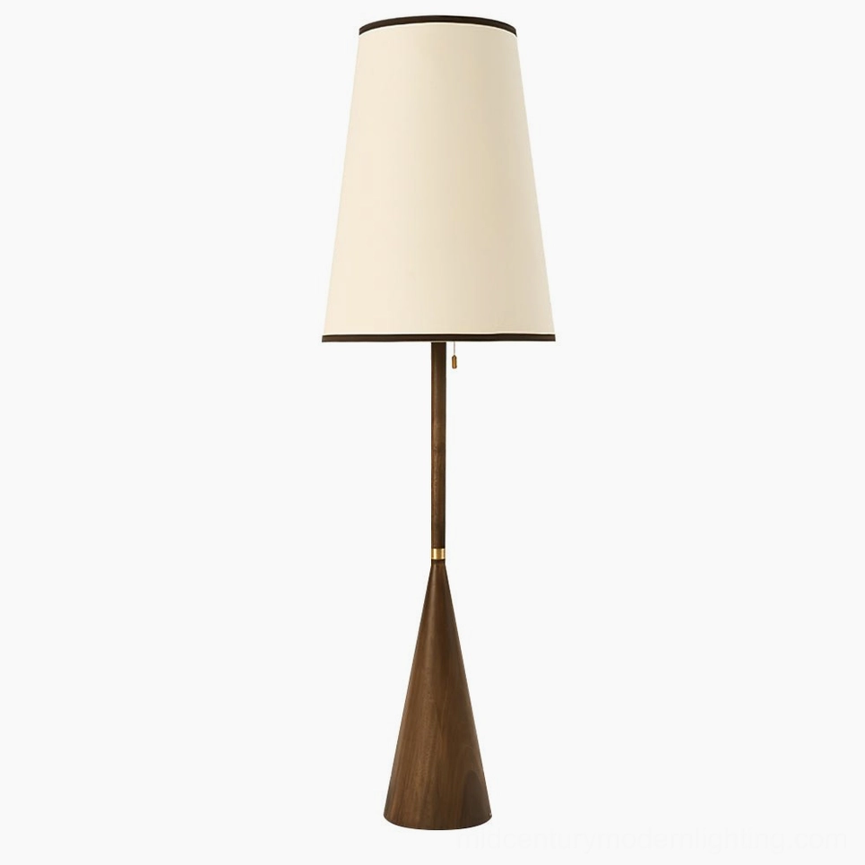 Mezzo mid-century modern floor lamp with tapered walnut wood base and cream fabric shade, front studio view