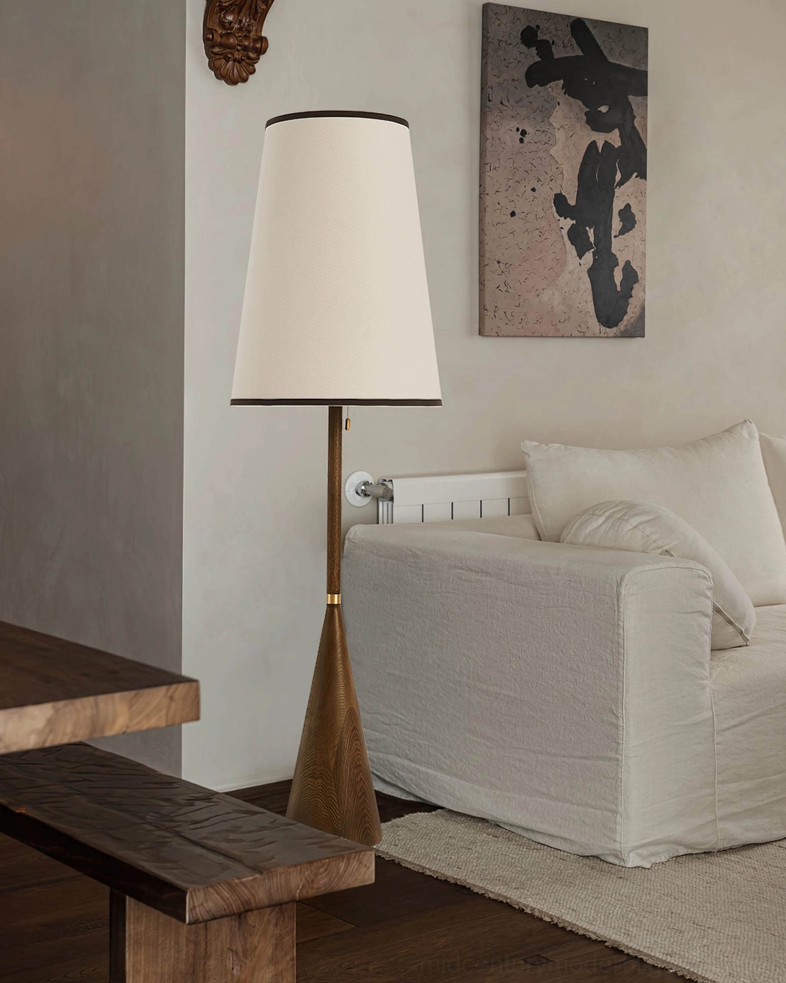 Mezzo mid-century floor lamp in minimalist rustic living space with white linen sofa and wood furniture