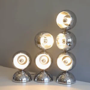 Three stacked Mickey chrome sphere table lamps in silver finish displayed together on tabletop, demonstrating height variations and grouping potential