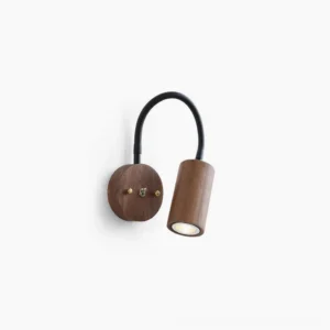 Micro wall lamp with walnut wood finish and matte black curved arm in studio view