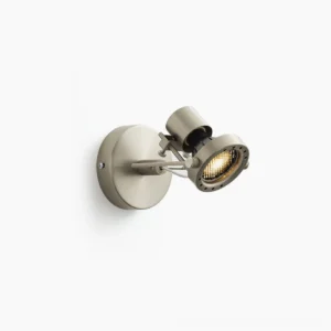 Mid-century modern adjustable wall spotlight with brushed nickel finish and rotatable lamp head, side perspective view