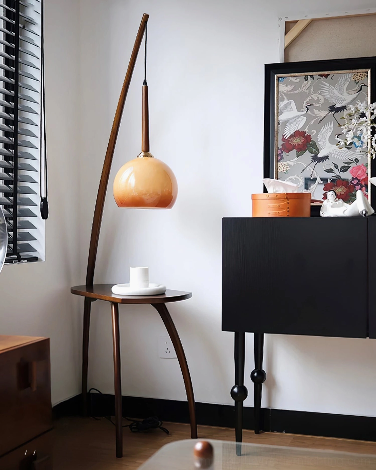 Arc floor lamp with integrated side table, mid-century modern design, ambient lighting setup