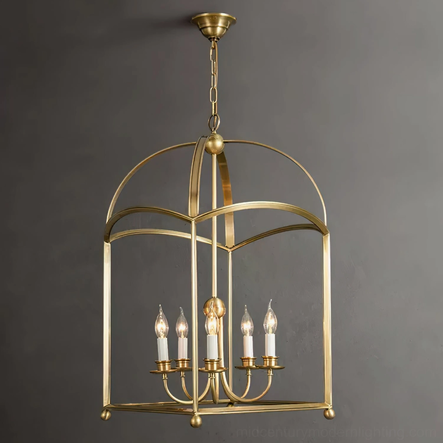 Mid-century modern brass chandelier three-quarter angle view dark background