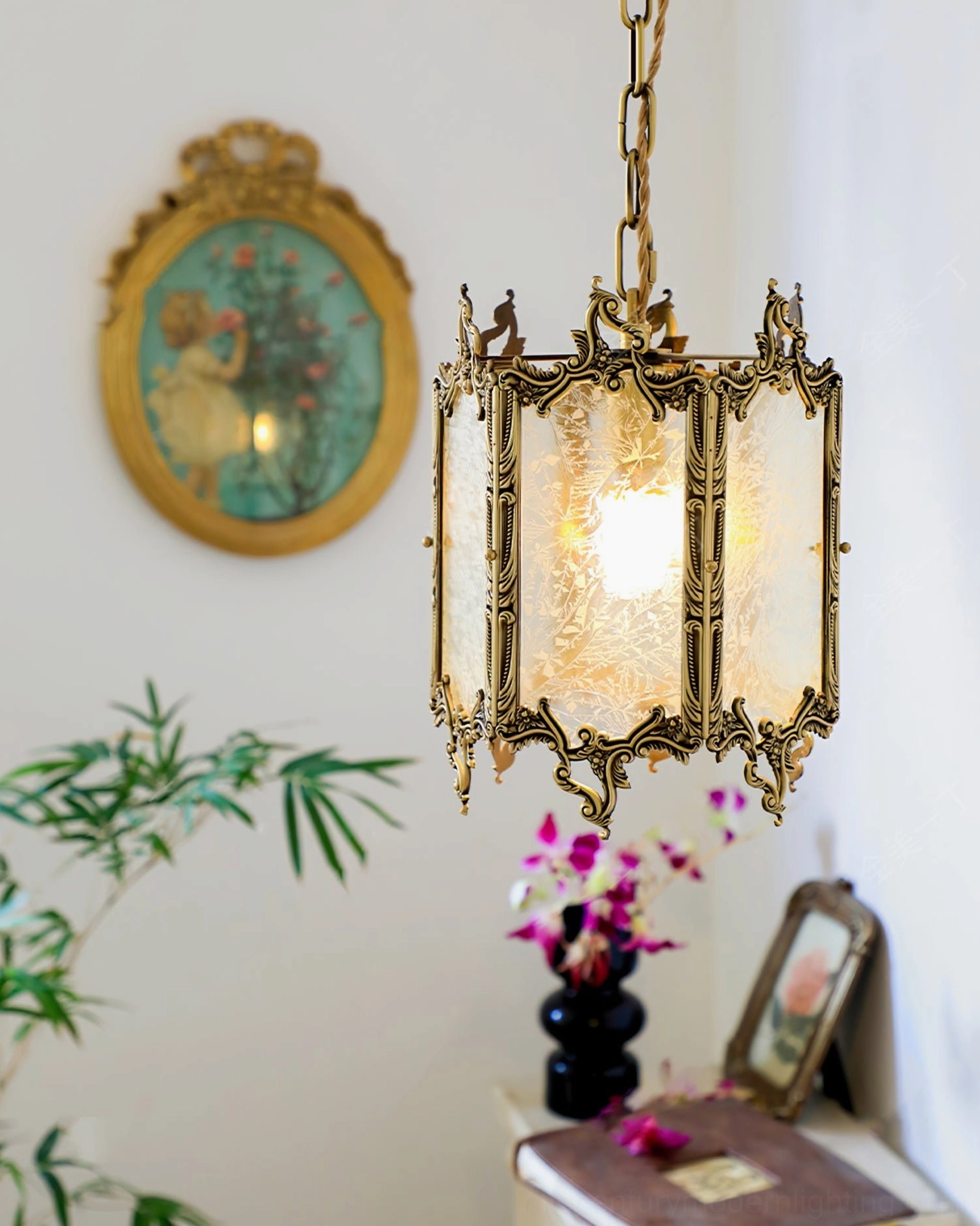 Mid-century modern brass lantern pendant installed in vintage home vanity corner with wall art and classic decor styling