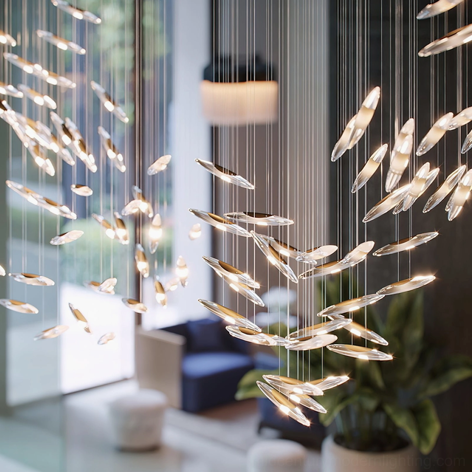 Mid-century modern inspired cascading glass chandelier with warm golden metallic accents