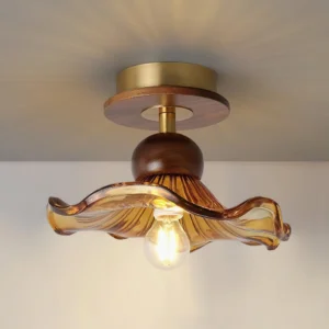Overhead angle view of mid-century modern flush mount ceiling light showing textured amber glass and walnut base