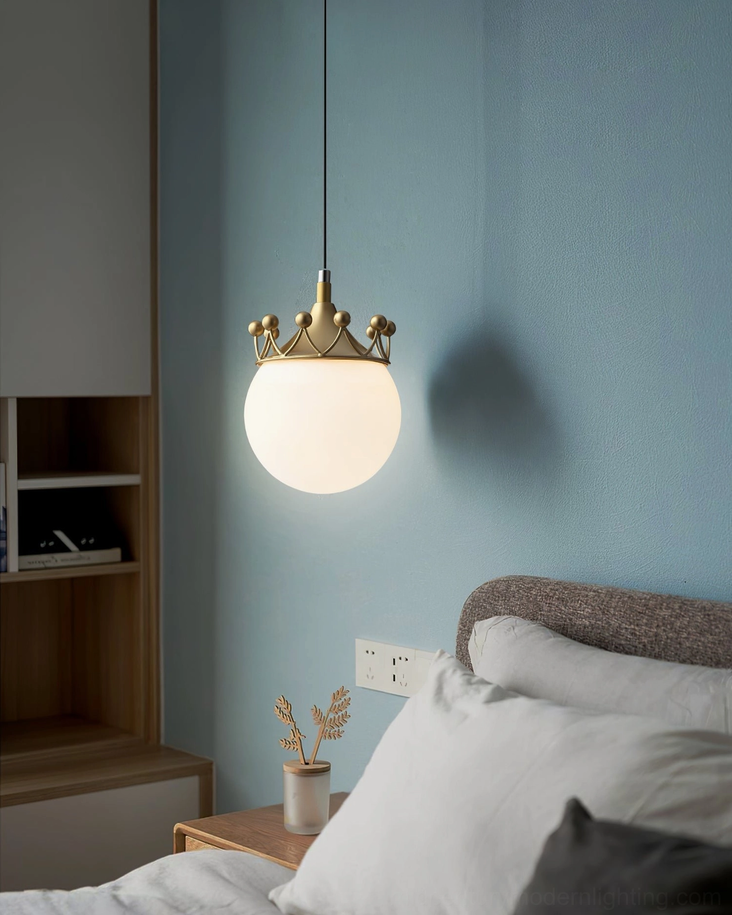 Mid-century modern crown pendant ceiling light creating warm glowing ambiance in contemporary bedroom interior design