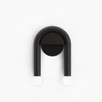Mid-century modern double arched wall sconce with dual globe lights, matte black metal finish, frontal studio view