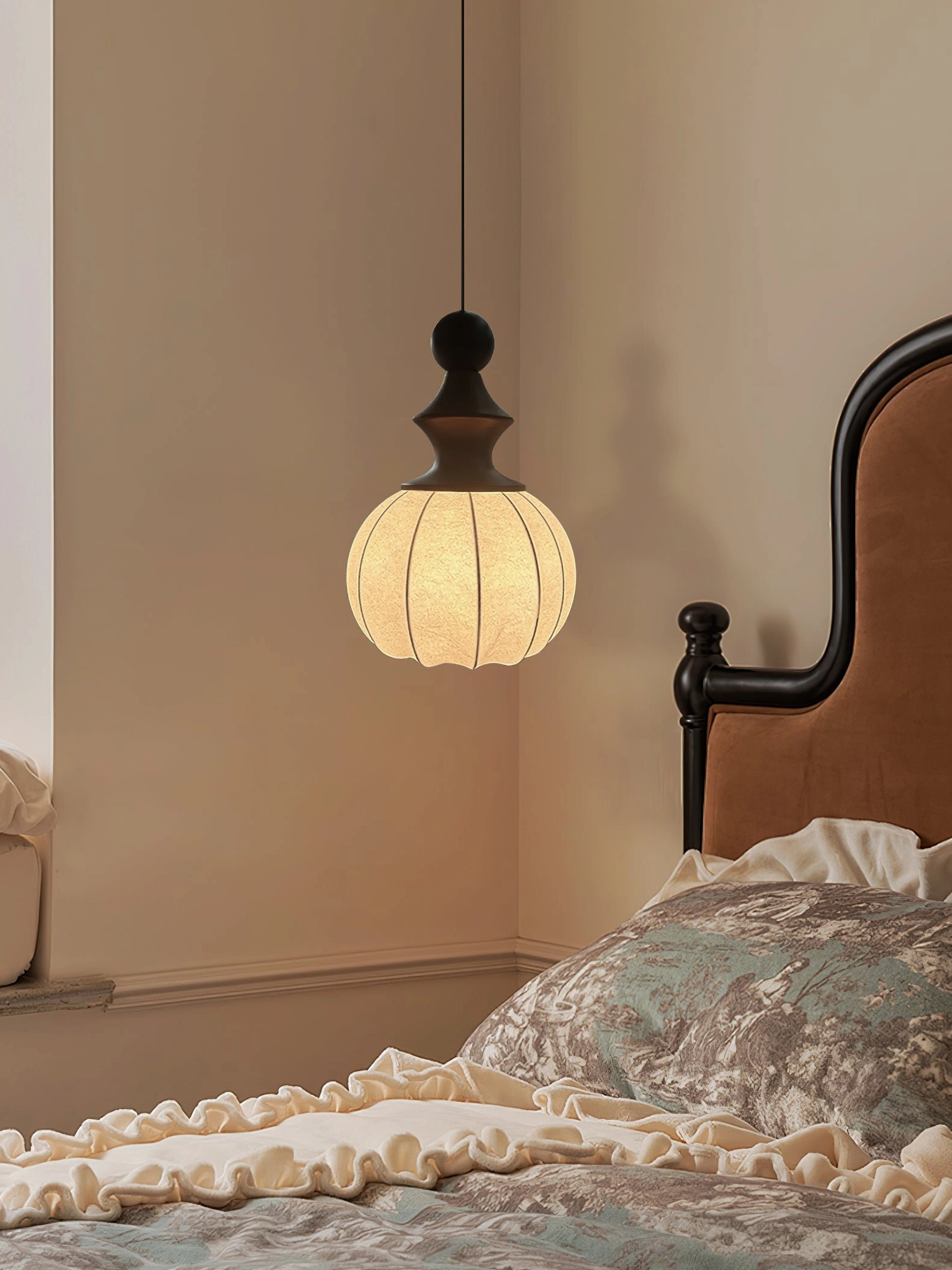 Mid-century modern fabric pendant lamp showing turned wood construction and warm diffused light in contemporary interior design