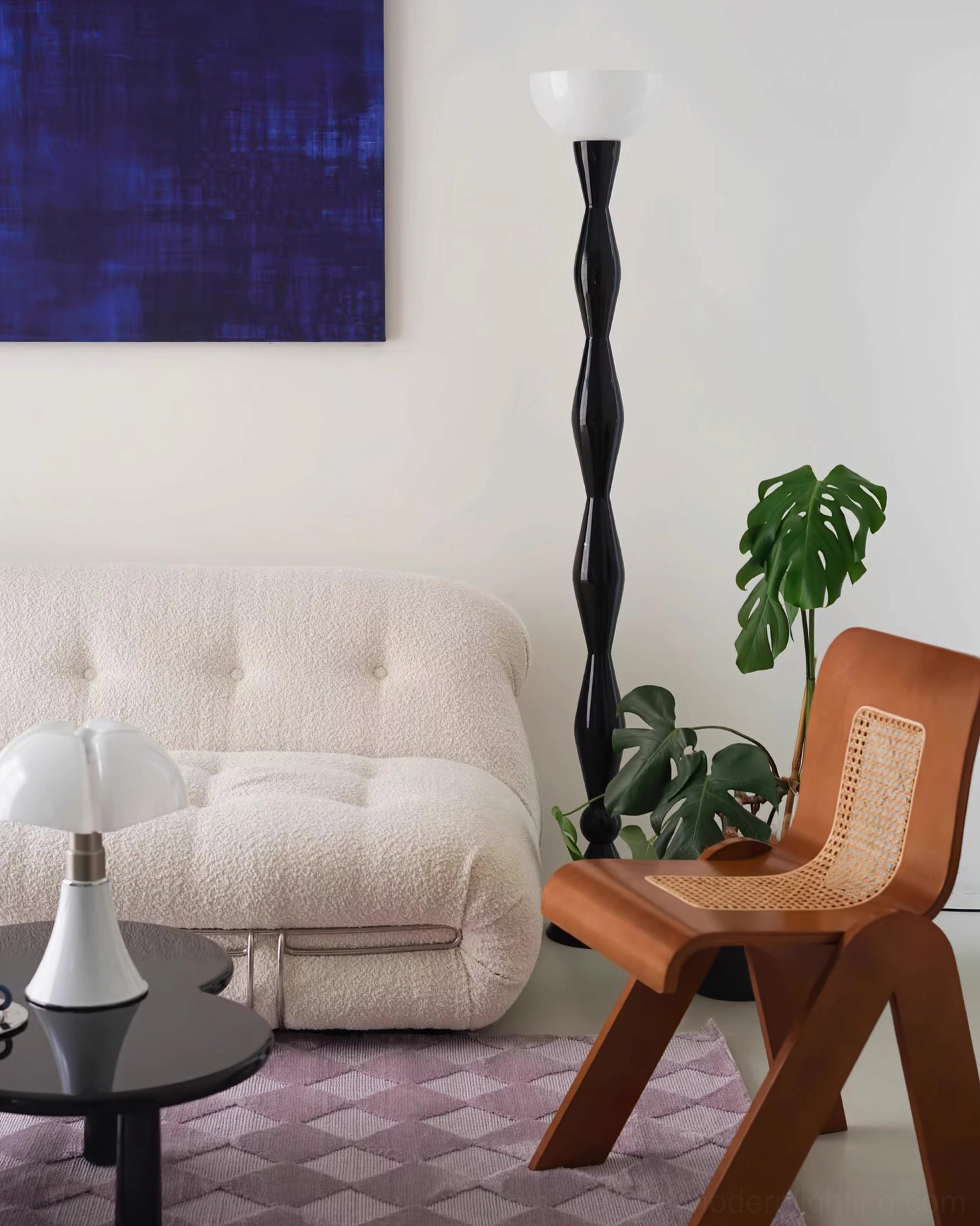 Mid-century modern twisted floor lamp beside tufted sofa with green plants in warm bohemian living room