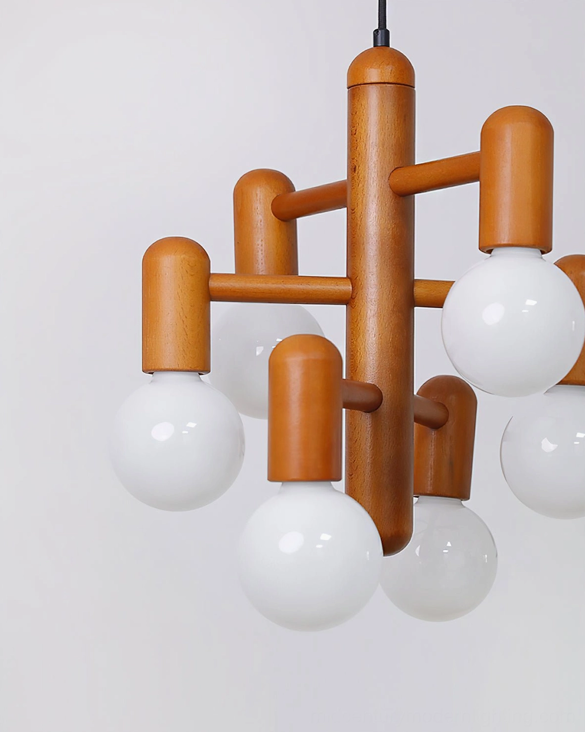Side close-up of minimalist geometric wooden pendant light structure and design