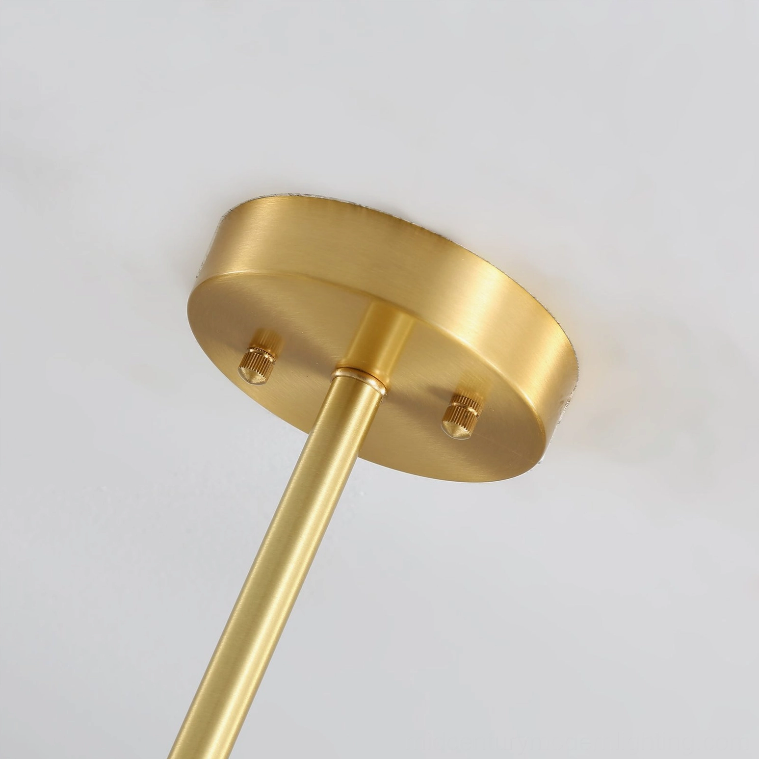 Mid-century modern Gino chandelier with frosted globes and brass accents detailed view