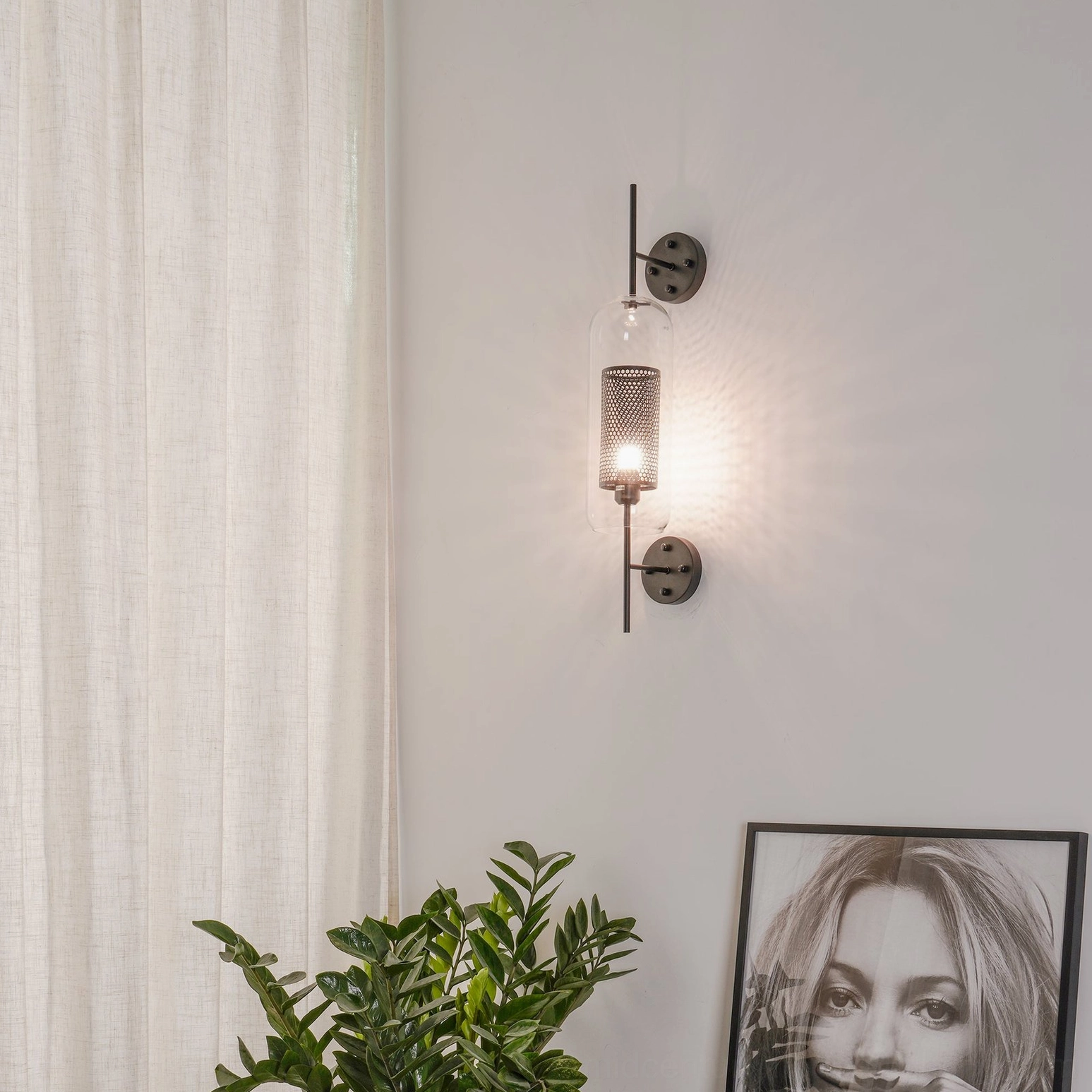 Mid-century modern glass wall lamp installed in contemporary home interior