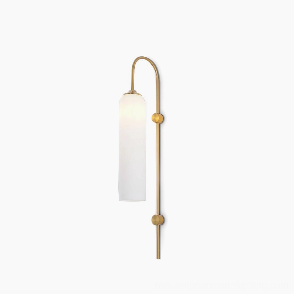 Frosted white cylindrical glass wall sconce with curved brass arm and dual gold accents on white background