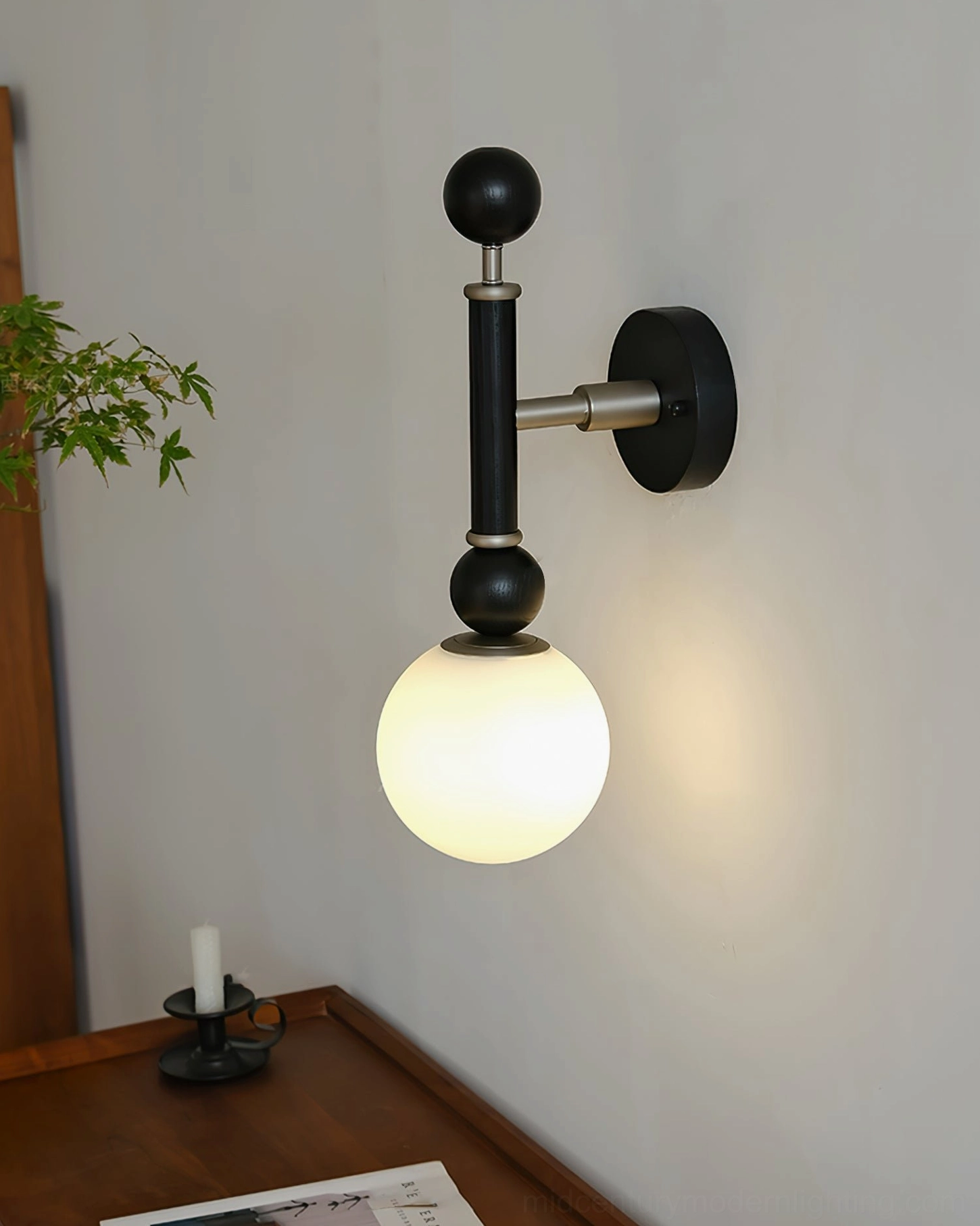 Mid-century modern globe wall lamp detail showing construction quality and design refinement