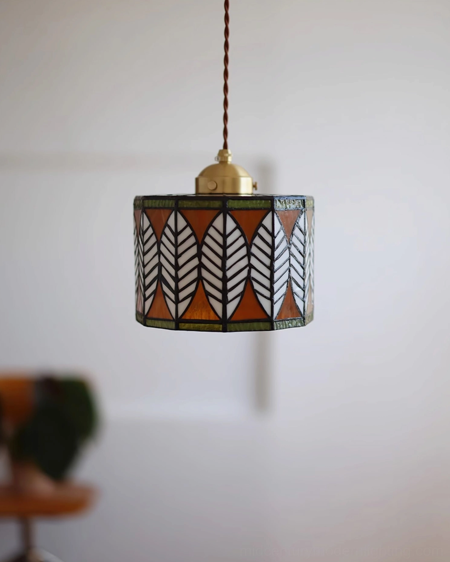 Mid-century modern Tiffany pendant with white leaf stained glass and black geometric pattern